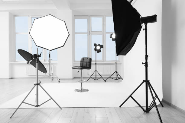 istock Interior of modern photo studio with bar stool and professional lighting equipment 1812072861