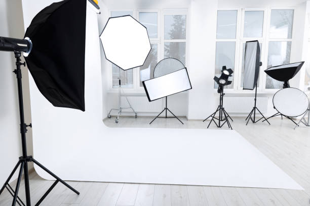 istock Interior of modern photo studio with professional lighting equipment 1812073369