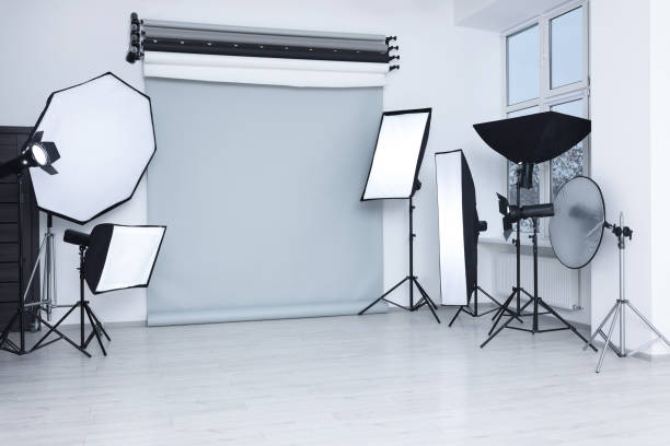 istock Interior of modern photo studio with professional lighting equipment 1812074461