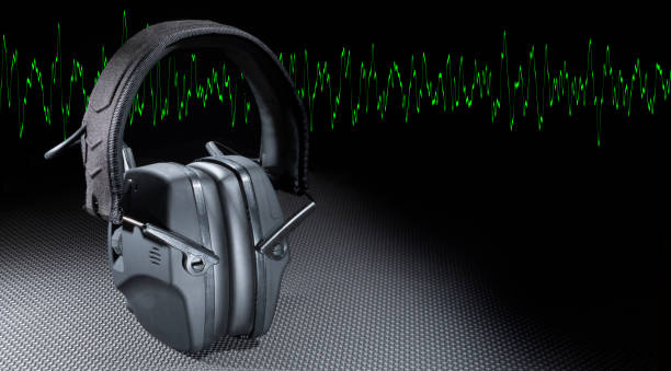 istock Green sine wave and protective headphones 1812076130