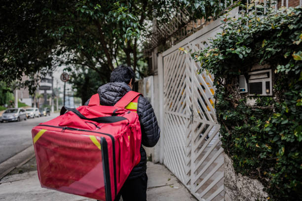 istock Delivery man arriving in a house 1812086812