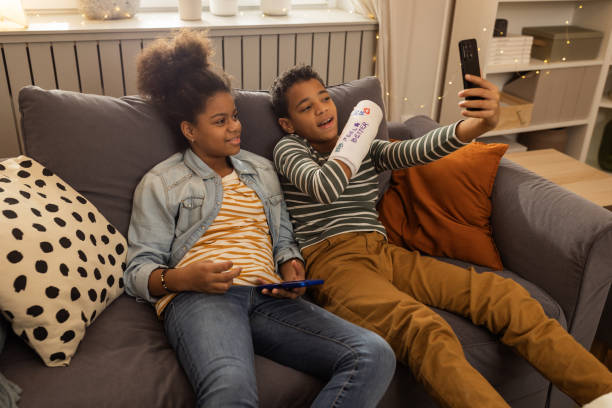 istock Brother and sister bonding at home 1812100473