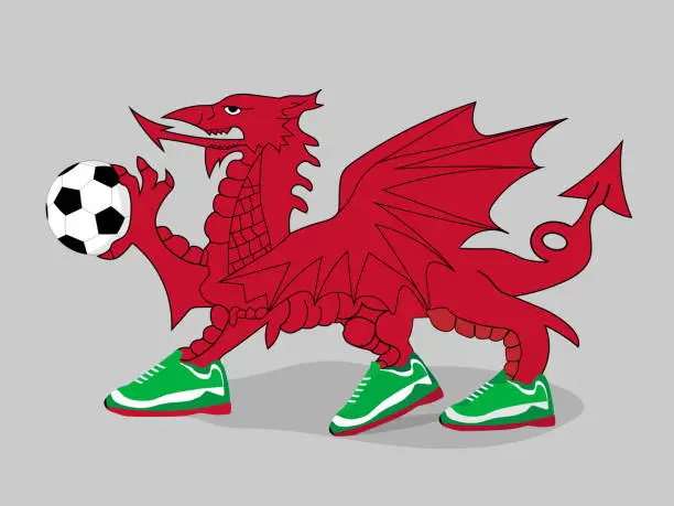 Vector illustration of Welsh dragon plays football