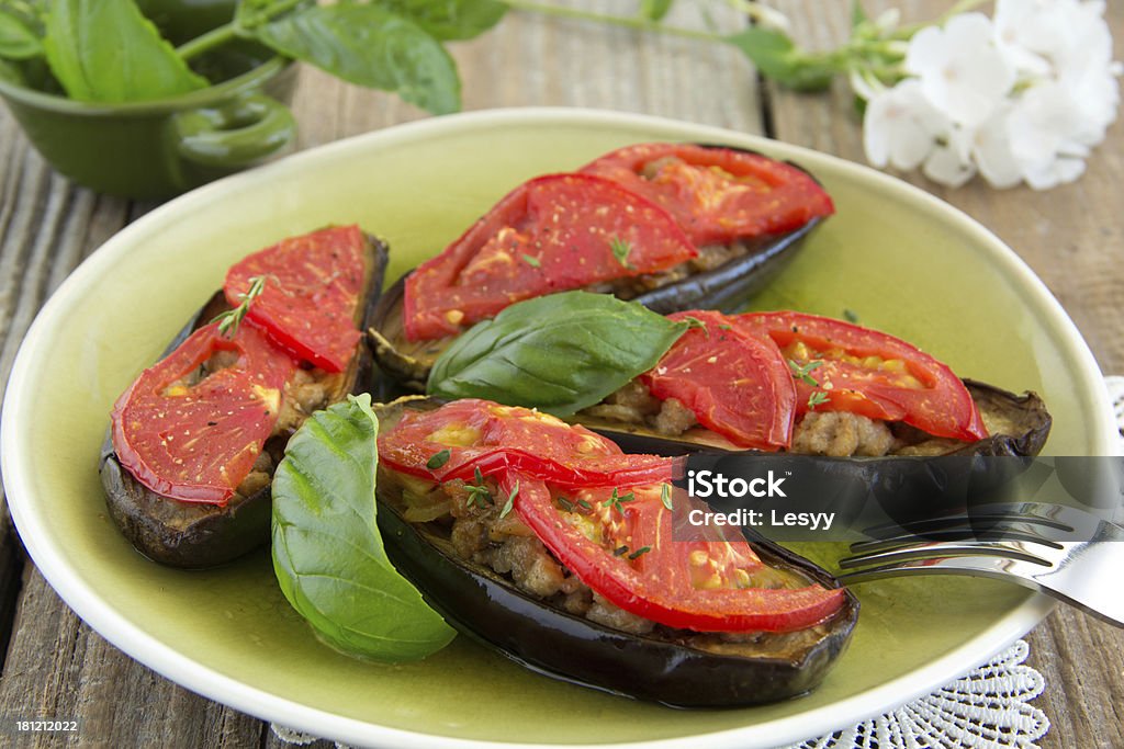 Grilled eggplant with tomatoes and meat. Baked Stock Photo