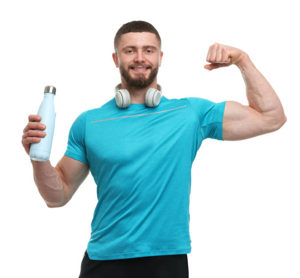 istock Handsome man with thermo bottle and headphones on white background 1812122816