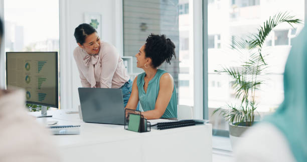 istock Business women, laptop or documents help for company kpi analytics, target audience research or digital marketing branding. Smile, happy and talking creative designer, coworking office mentor or tech 1812141431