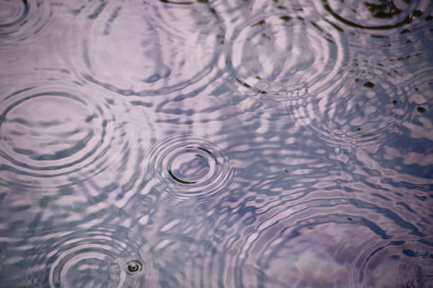raindrops 落ちる水に - ripple concentric wave water ストックフォトと画像