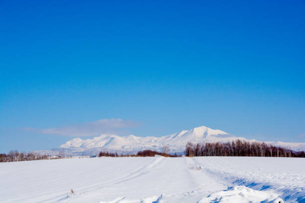 istock Winter hills and snowy mountains on a sunny day 1812207361