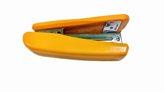 Orange stapler on white background. Orange stapler isolated on white background with clipping path
