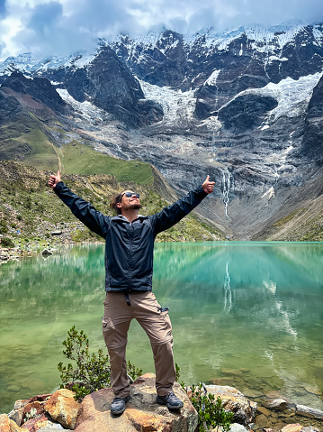 A man enjoying his visit to the Humantay Lagoon in Cusco.