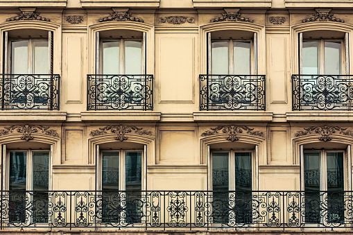 Typical Townhouse Apartments with Wrought Iron Railing in downtown Paris, France.