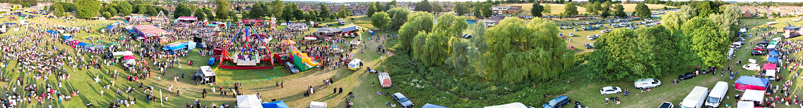 High Angle Panoramic View of a Funfair with Rides for Local Public of Luton City of England UK. The Funfair Was Held During Holidays to Celebrate Eid Festival of Muslim Community Who is Living at Luton Town of UK. The Funfair Was Held on June 29th, 2023