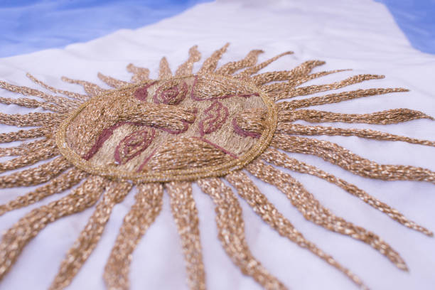Sun embroidered in gold threads on the Argentinian flag.