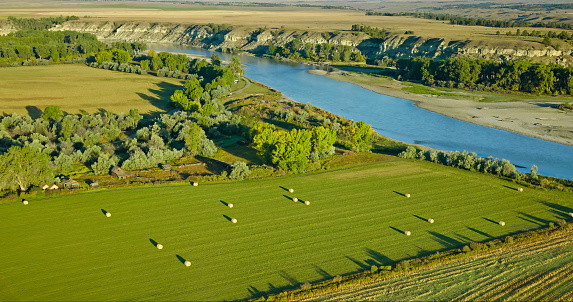 Aerial view of farmland alongside Yellowstone River near Custer, a village in Yellowstone County, Montana, on a clear day in Fall.