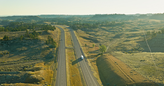 Aerial shot of truck on Interstate 94 in Yellowstone County, Montana on a clear day in Fall.