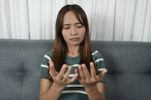 istock Asian woman has itchy hands 1812260437