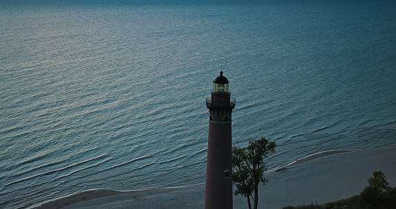 Aerial shot of Lake Michigan at sunset from near Little Sable Point Light in Silver Lake State Park in Golden Township, Oceana County.