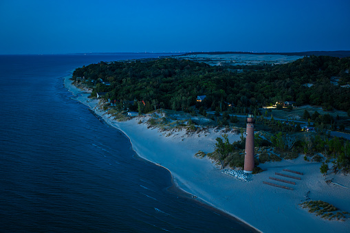 Aerial shot of Lake Michigan at sunset from near Little Sable Point Light in Silver Lake State Park in Golden Township, Oceana County.