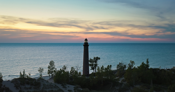 Aerial shot of Lake Michigan at sunset from near Little Sable Point Light in Silver Lake State Park in Golden Township, Oceana County.