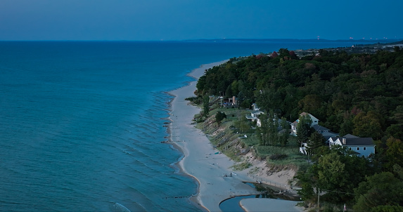Aerial shot of Lake Michigan at sunset from near Little Sable Point Light in Silver Lake State Park in Golden Township, Oceana County.