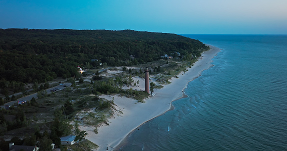 Aerial shot of Lake Michigan at sunset from near Little Sable Point Light in Silver Lake State Park in Golden Township, Oceana County.