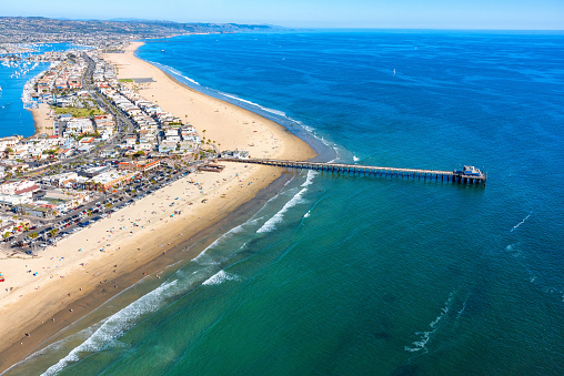 Aerial view of the beautiful Orange County California coastal town of Newport Beach from an altitude of about 1000 feet over the Pacific Ocean during a helicopter photo flight.