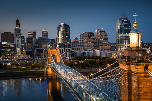 Aerial still image of the Central Business District sitting behind John A. Roebling Suspension Bridge on a clear, Fall evening in Cincinnati, Ohio. Authorization was obtained from the FAA for this operation in restricted airspace.