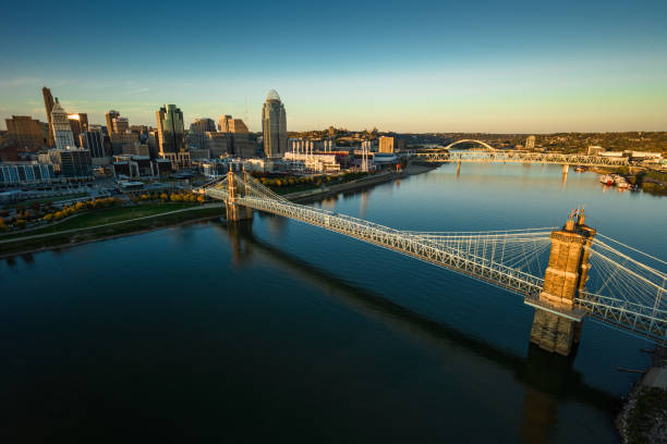 Aerial still image of the John A. Roebling Suspension in the Ohio River, with Cincinnati's Central Business District in the background on a clear evening in Fall. Authorization was obtained from the FAA for this operation in restricted airspace.