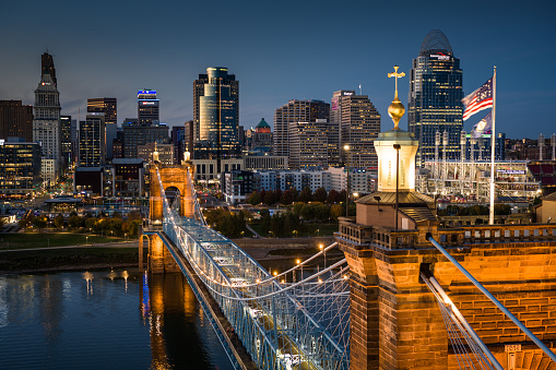 Aerial still image of the Central Business District sitting behind John A. Roebling Suspension Bridge on a clear, Fall evening in Cincinnati, Ohio. Authorization was obtained from the FAA for this operation in restricted airspace.
