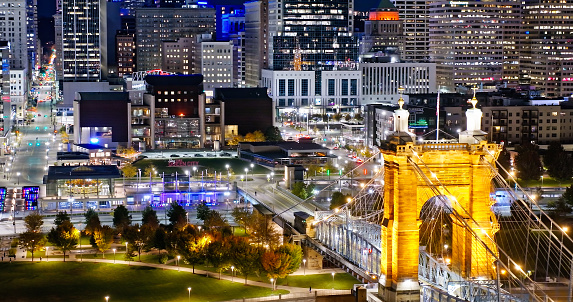 Aerial still image of the John A. Roebling Bridge, with the Central Business District in background, on a clear, Fall evening in Cincinnati, Ohio. Authorization was obtained from the FAA for this operation in restricted airspace.