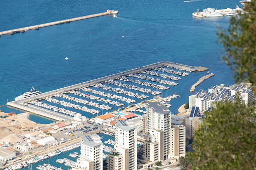 Elevated view of Mid Town Marina and Mid Town Estate, off the west coast of Gibraltar. The Small Boat Harbour and Coaling Island Boat Harbour can also be seen.