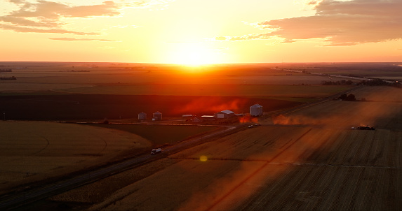 Aerial still image of acres of farmland in the village of Brule, Nebraska, taken by a drone at sunset.