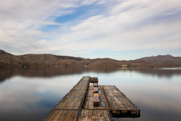 A long exposure of Lake Hibara in the mountains of Fukushima with a wooden pier.