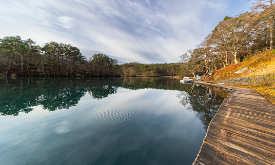 An early morning view of calm Goshiki Pond, with no people.