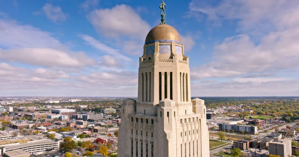 istock Nebraska State Capitol Tower under Cloudy Sky - Aerial Shot 1812321995