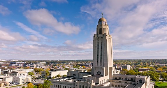 Aerial shot of the Nebraska State Capitol building in downtown Lincoln on a sunny Fall day. Authorization was obtained from the FAA for this operation in restricted airspace.