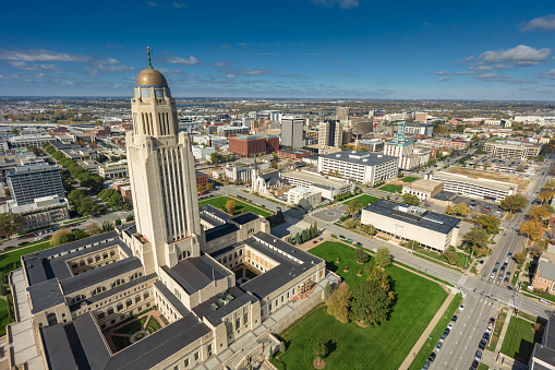 Aerial shot of the Nebraska State Capitol building in downtown Lincoln on a sunny Fall day. Authorization was obtained from the FAA for this operation in restricted airspace.