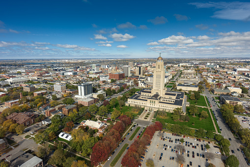 Aerial shot of the Nebraska State Capitol building in downtown Lincoln on a sunny Fall day. Authorization was obtained from the FAA for this operation in restricted airspace.