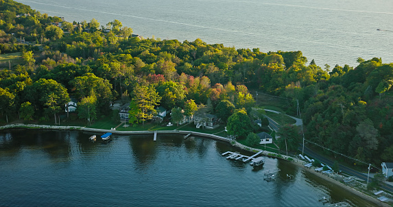 Aerial still image of houses on White Lake in Whitehall, Michigan, on a clear day in Fall.