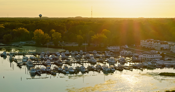 Aerial still of a marina in White Lake, Whitehall, Michigan, on a Fall sunset.