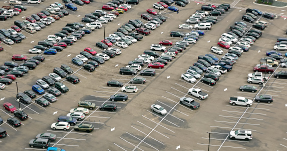 Aerial view of a parking lot in Maple Grove, a suburban city in Hennepin County, Minnesota, on an overcast day in Fall.