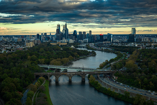 Aerial still image looking south over Fairmount at the urban skyline of Philadelphia, Pennsylvania on a cloudy evening in Fall.