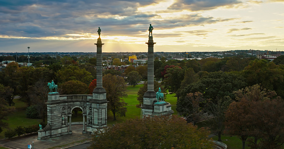 Aerial still image of Smith Memorial Arch in the Centennial District of Philadelphia, Pennsylvania on a cloudy evening in Fall.