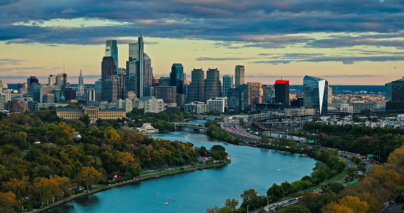 Aerial still image of the Center City skyline from over East Parkside in Philadelphia, Pennsylvania on a cloudy evening in Fall.