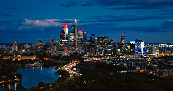 Aerial still image of the Center City skyline from over East Parkside in Philadelphia, Pennsylvania at twilight in Fall.
