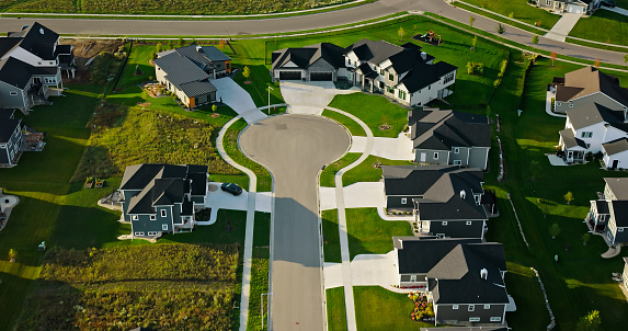 Aerial shot of cookie-cutter houses, with more under construction, in Windsor, a village in Dane County, Wisconsin, on a clear day in Fall.\n\nAuthorization was obtained from the FAA for this operation in restricted airspace.