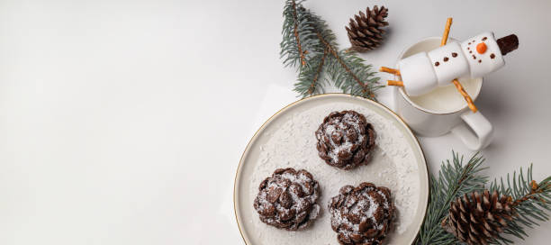 istock Christmas tree coneshaped cookies with chocolate flakes with powdered sugar, a delightful homemade dessert for the New Year. 1812353778