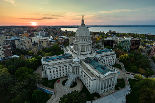 Aerial view of Wisconsin State Capitol building in downtown Madison, the capital city of Wisconsin, at sunset in Fall.

Authorization was obtained from the FAA for this operation in restricted airspace.