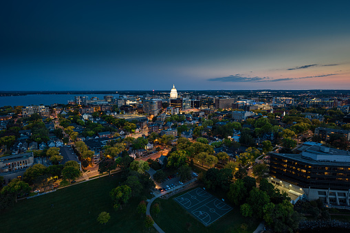 Aerial view of Wisconsin State Capitol building in downtown Madison, the capital city of Wisconsin, at twilight in Fall.

Authorization was obtained from the FAA for this operation in restricted airspace.