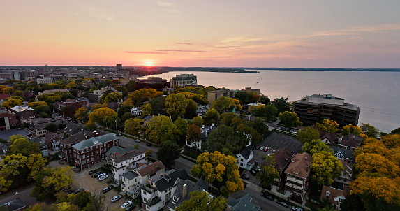 Aerial view of Madison, the capital city of Wisconsin, at sunset in Fall, with Lake Mendota beyond the city.

Authorization was obtained from the FAA for this operation in restricted airspace.